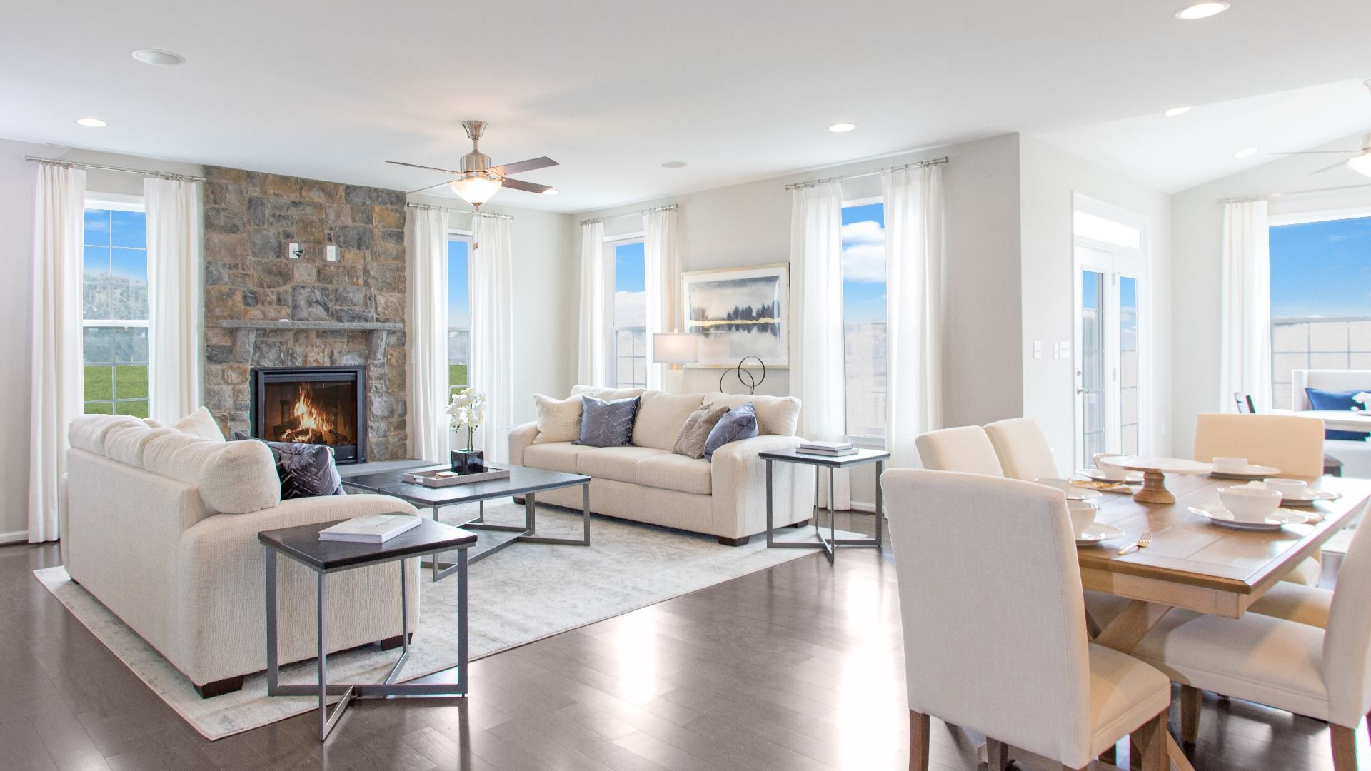 Family Room with fireplace and 4 large windows in a DRB Homes Cypress II home plan at Huntfield.