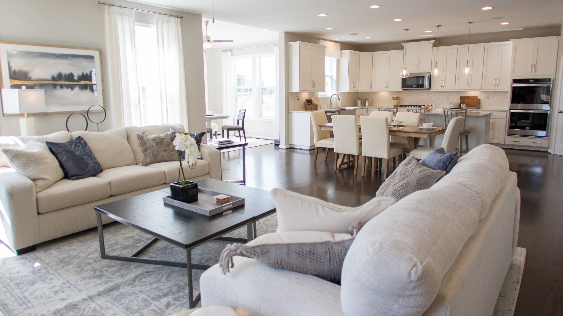 Open family room and kitchen in a DRB Homes Cypress II home plan at Huntfield