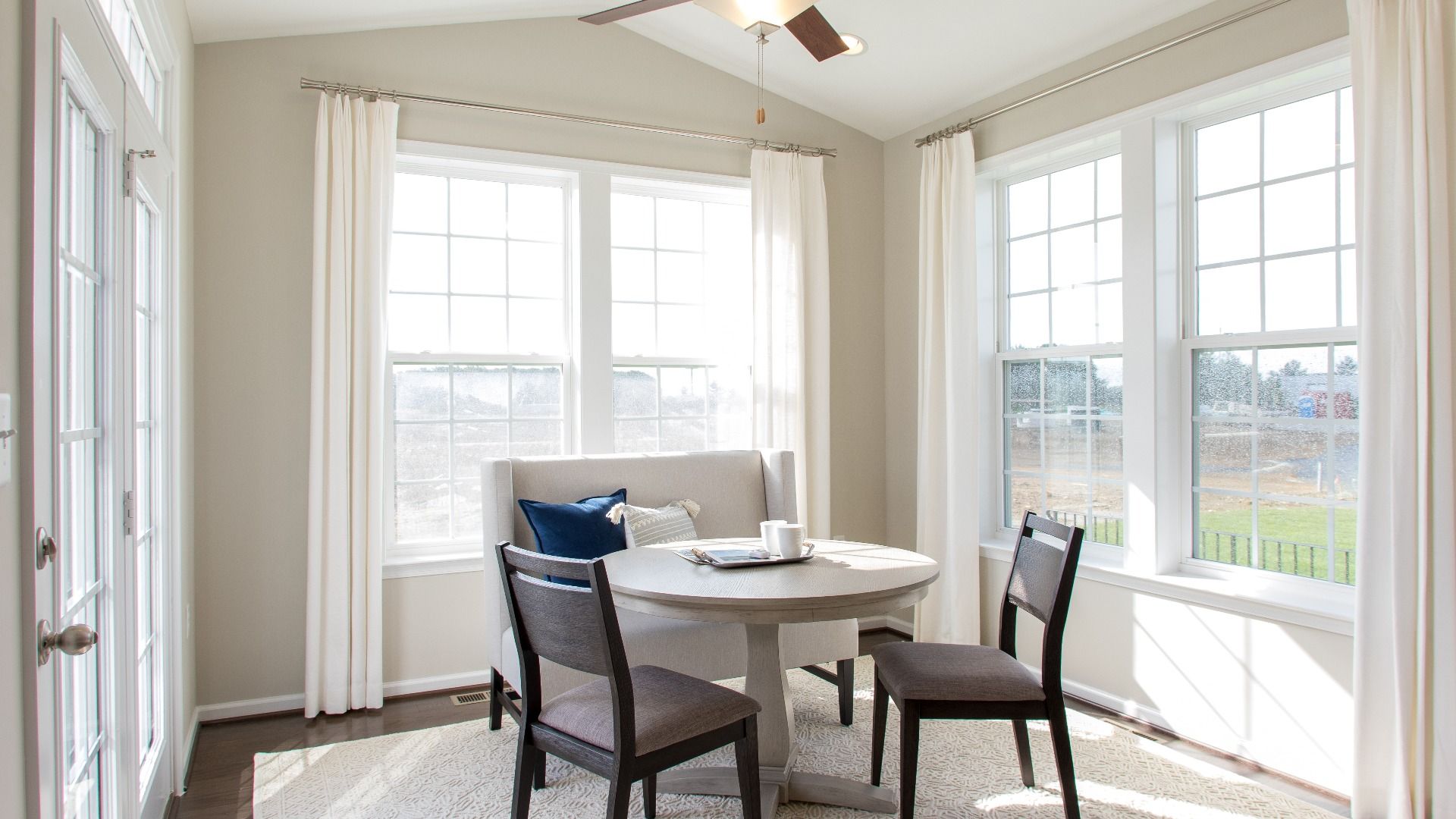 Morning Room with vaulted ceiling & 2 double windows on adjacent walls in a DRB Homes Cypress II plan at Huntfield.