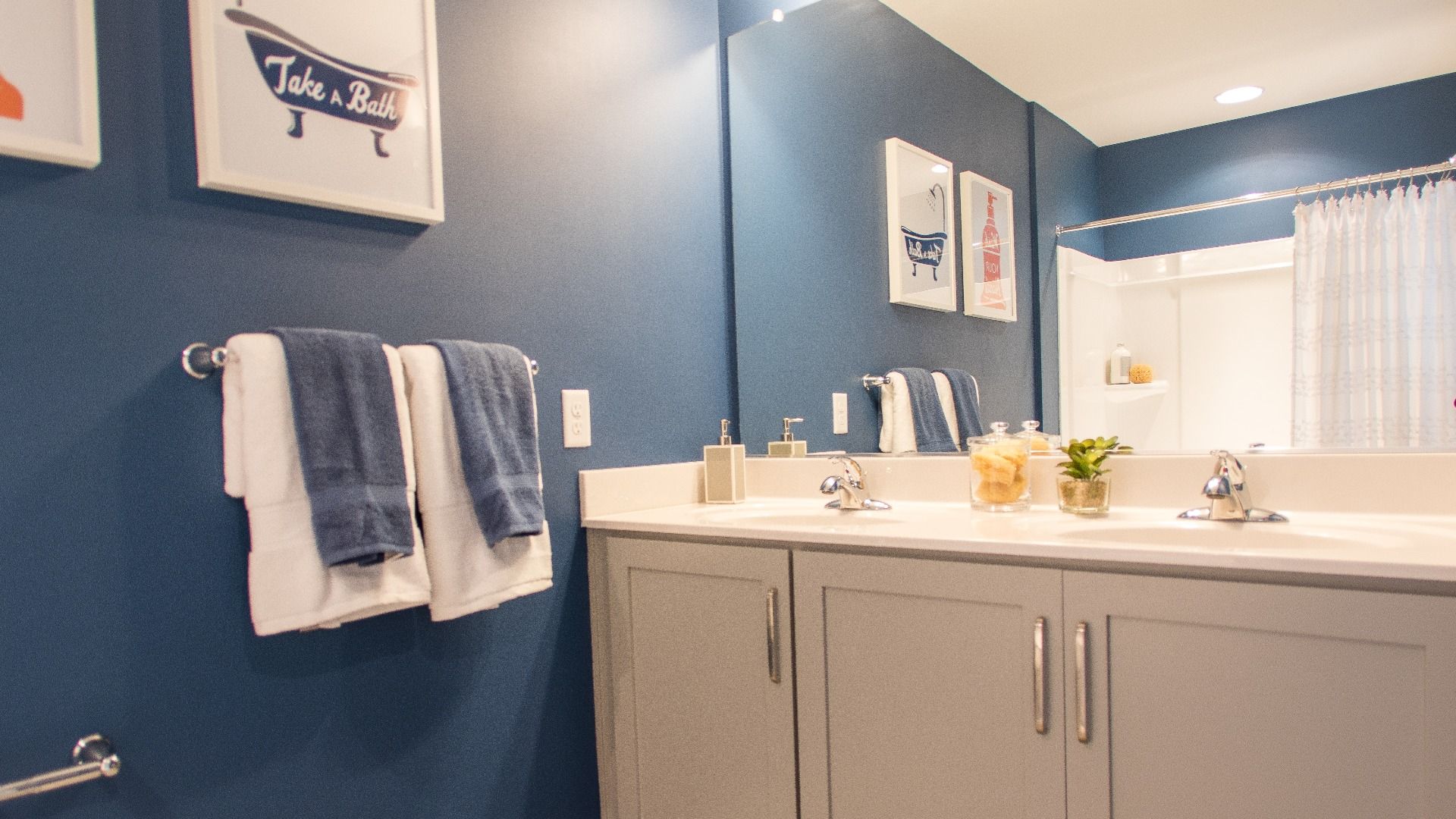 Full bath with dual sink vanity in a DRB Homes Cypress II home plan at Huntfield.
