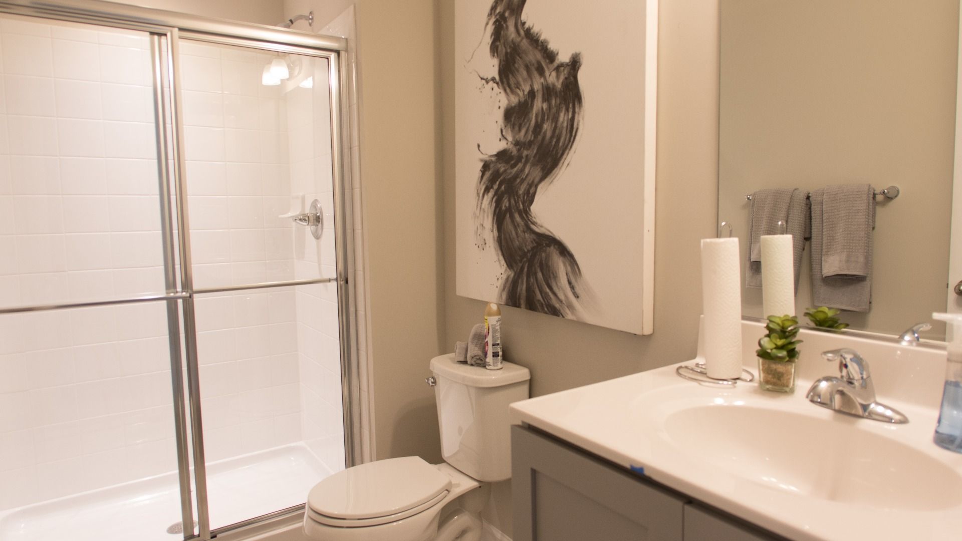 Lower level full bathroom with walk-in shower in a DRB Homes Cypress II home plan at Huntfield.