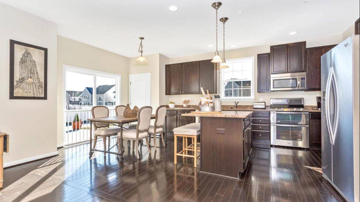 Kitchen in the Newbury II Single-Family Home by DRB Homes, with Dining Room and a Modern Open-Concept Design.