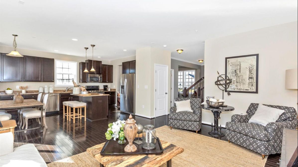 Another Angle of the Kitchen in the Newbury II Single-Family Home by DRB Homes with Dining Room and Living Room View.