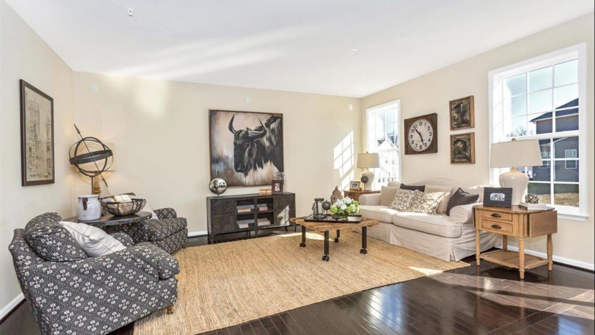 Living Room in the Newbury II Single Family Home by DRB Homes, with a Spacious and Open Design Perfect for Relaxation.