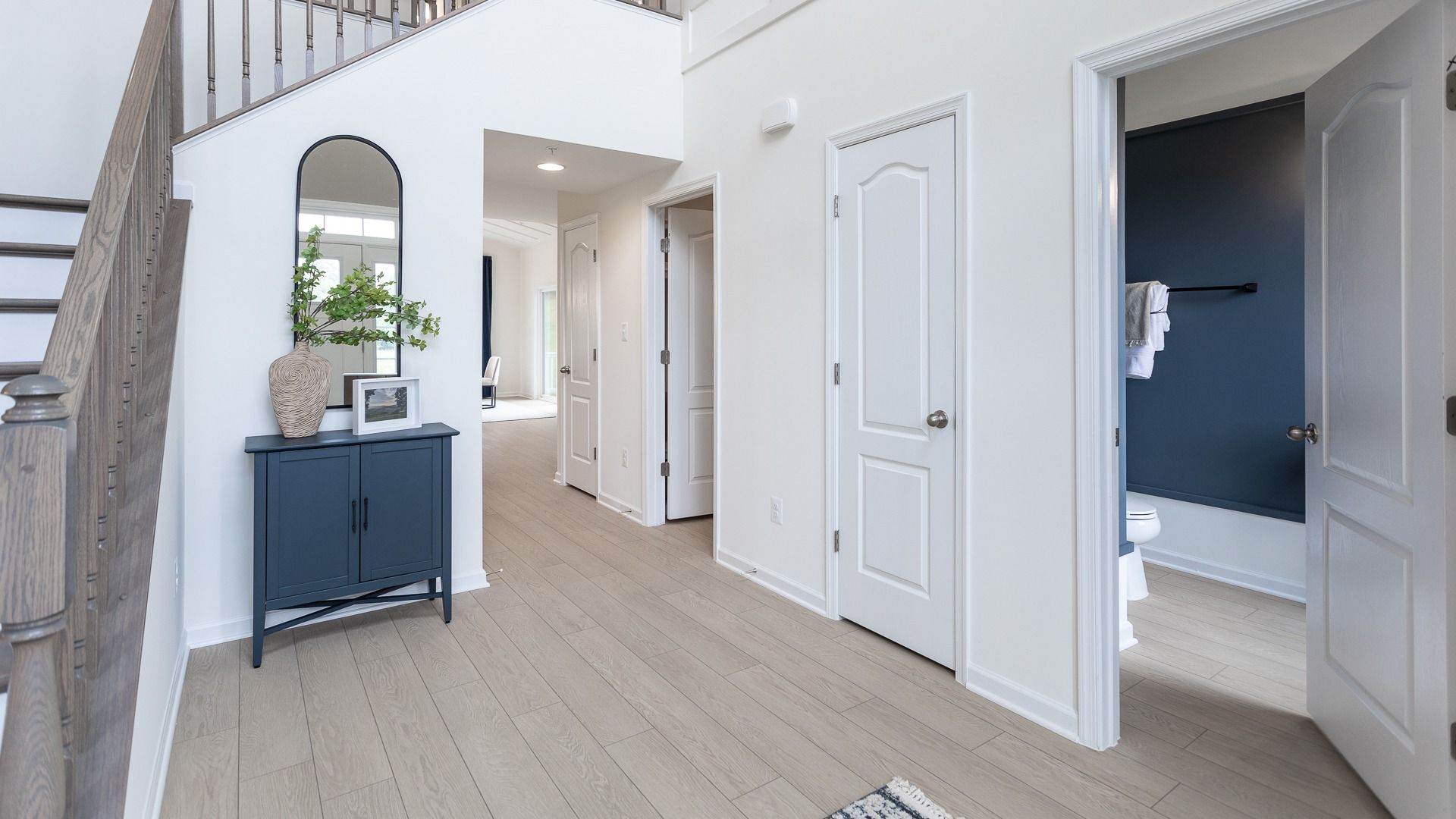 Elegant entryway and powder room of the Oakdale II plan, showcasing stylish design and inviting layout at Huntfield.