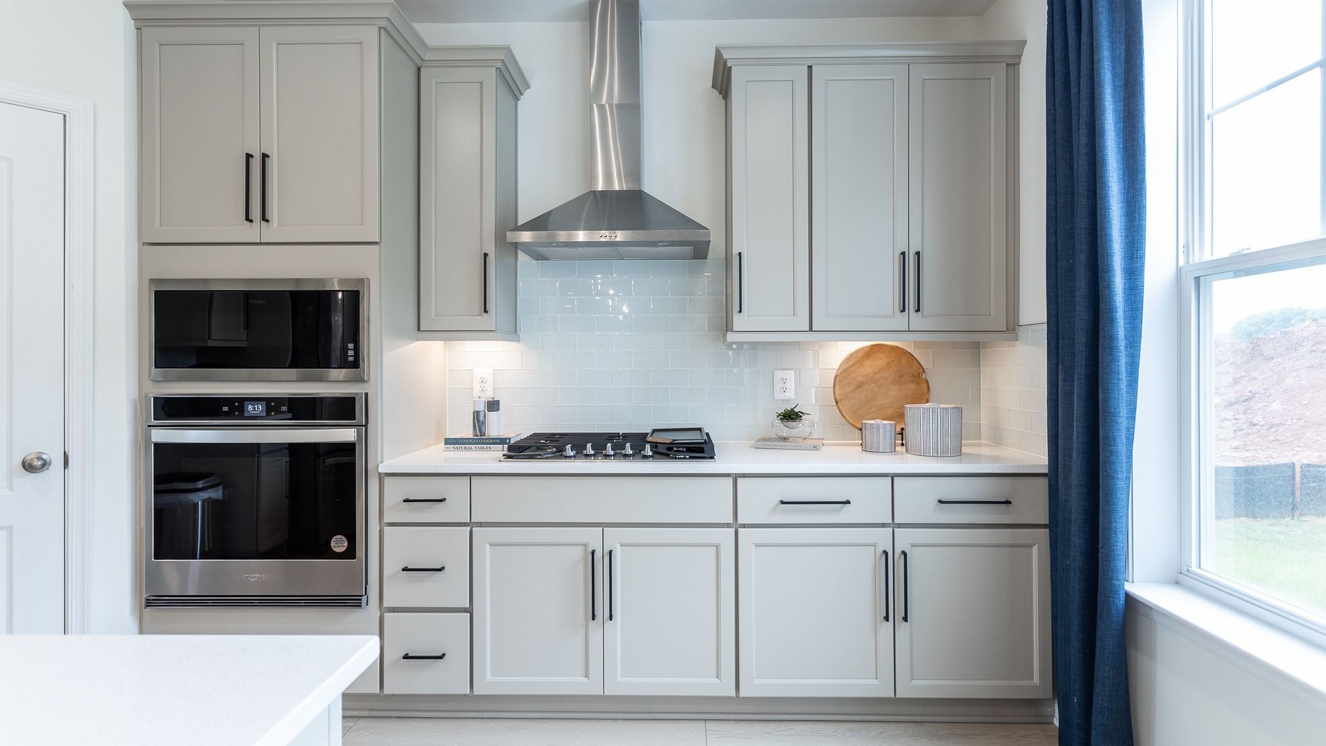 Spacious Oakdale II gourmet kitchen with sleek Whirlpool appliances and modern design.