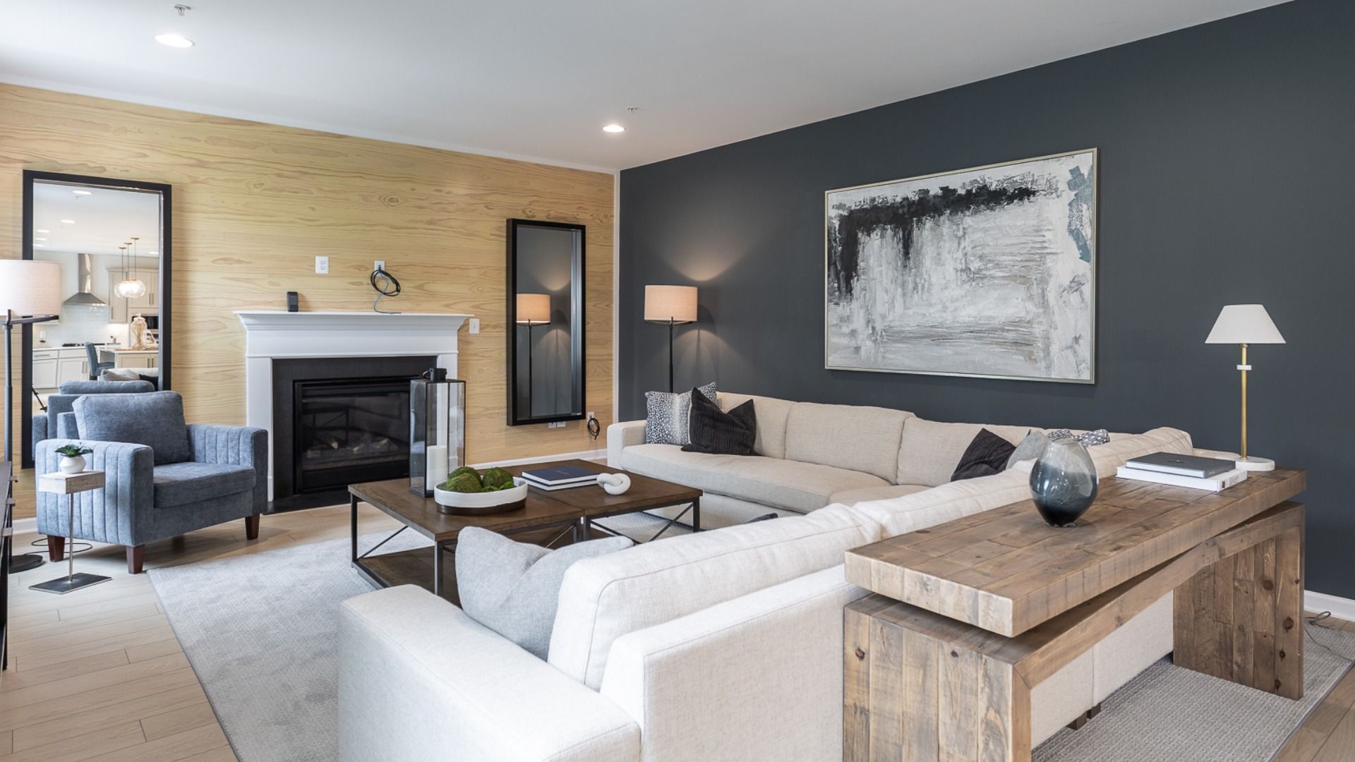 The Oakdale II Living Room Featuring a Cozy Fireplace and Spacious Design.