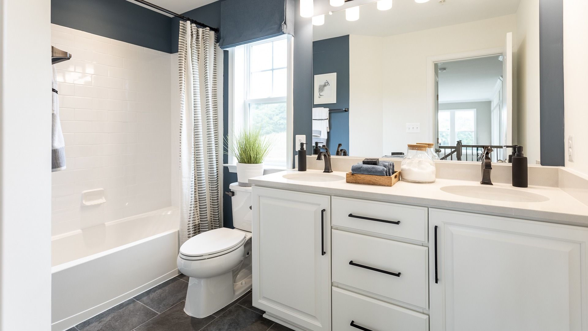 Bathroom 2 in the Oakdale II floor plan features sleek double vanity sinks and premium fixtures.