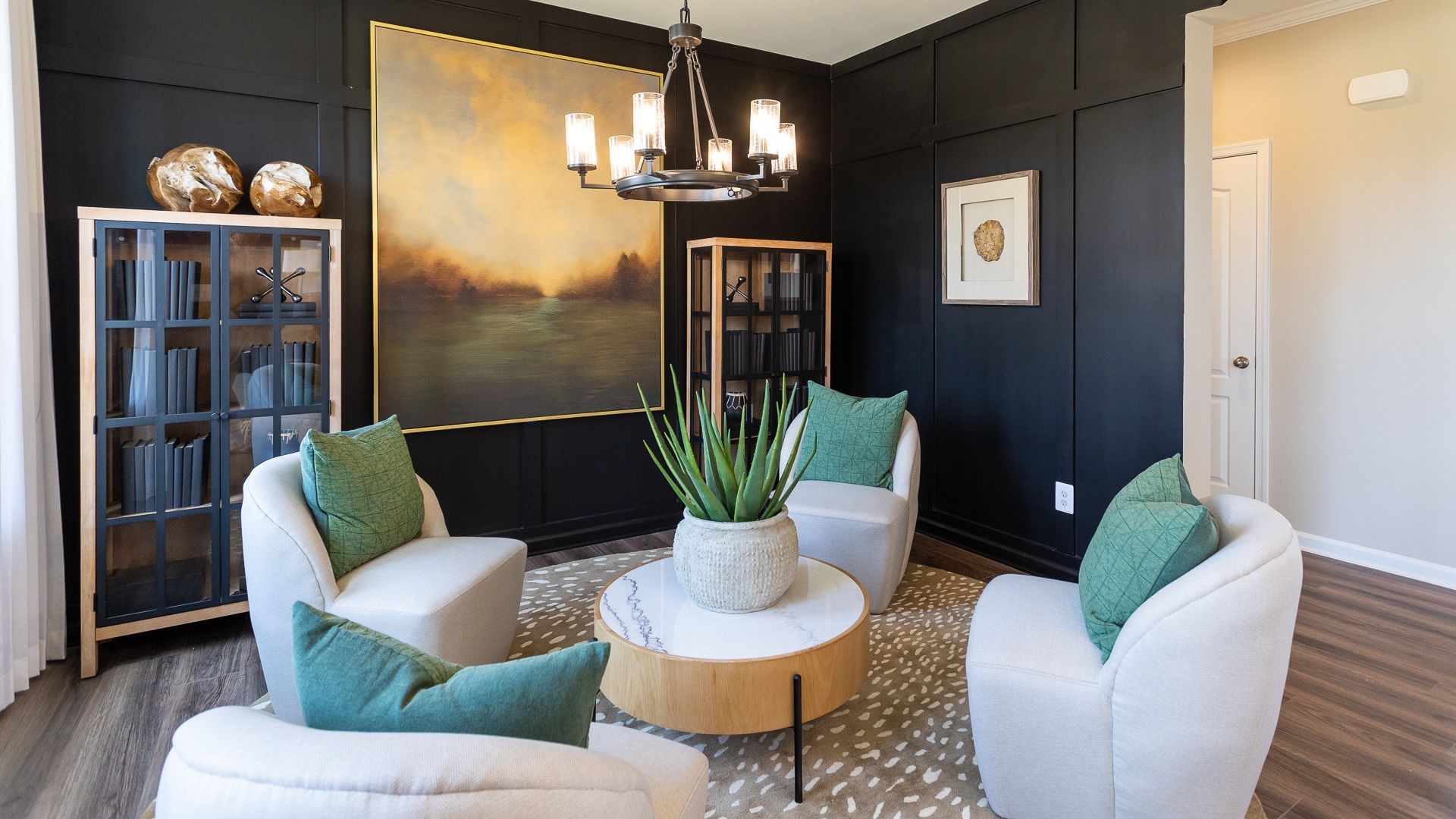 Living room with wood floors in a DRB Homes Castlerock II home plan at Huntfield.