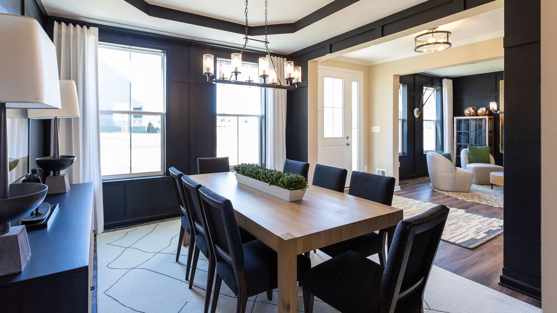 Dining room with tray ceiling and 2 large windows in a DRB Homes Castlerock II at Huntfield.