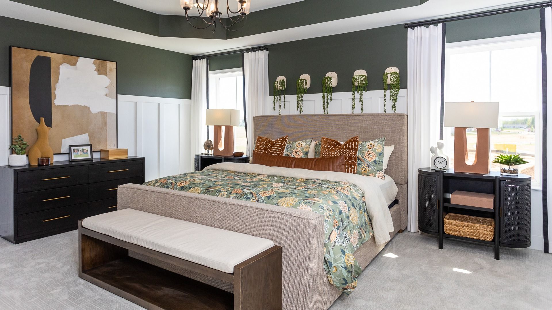 Carpeted owner's suite with tray ceiling in a DRB Homes Castlerock II home plan at Huntfield.