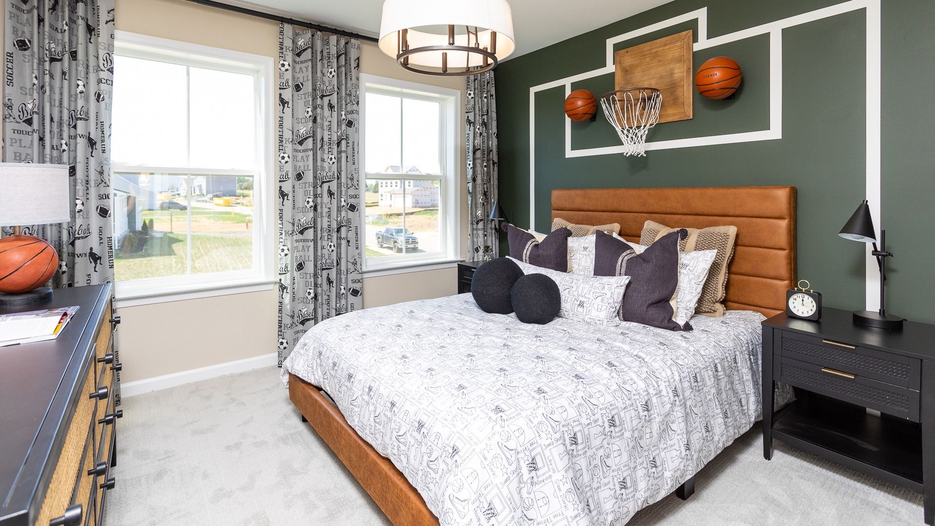 Carpeted secondary bedroom with 2 windows in a DRB Homes Castlerock II home plan at Huntfield.