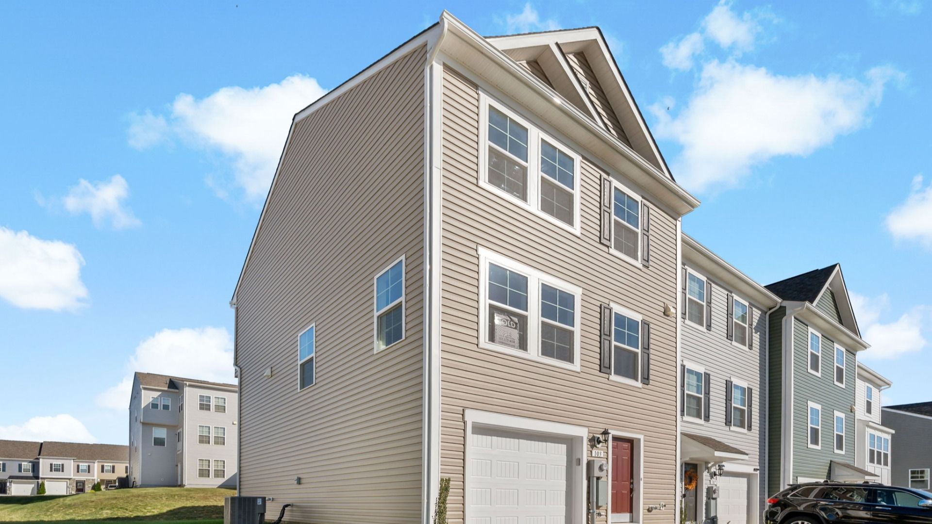 Side exterior view of York II floor plan at Kings Crossing Townhomes by DRB Homes, located in Charles Town, West Virginia.