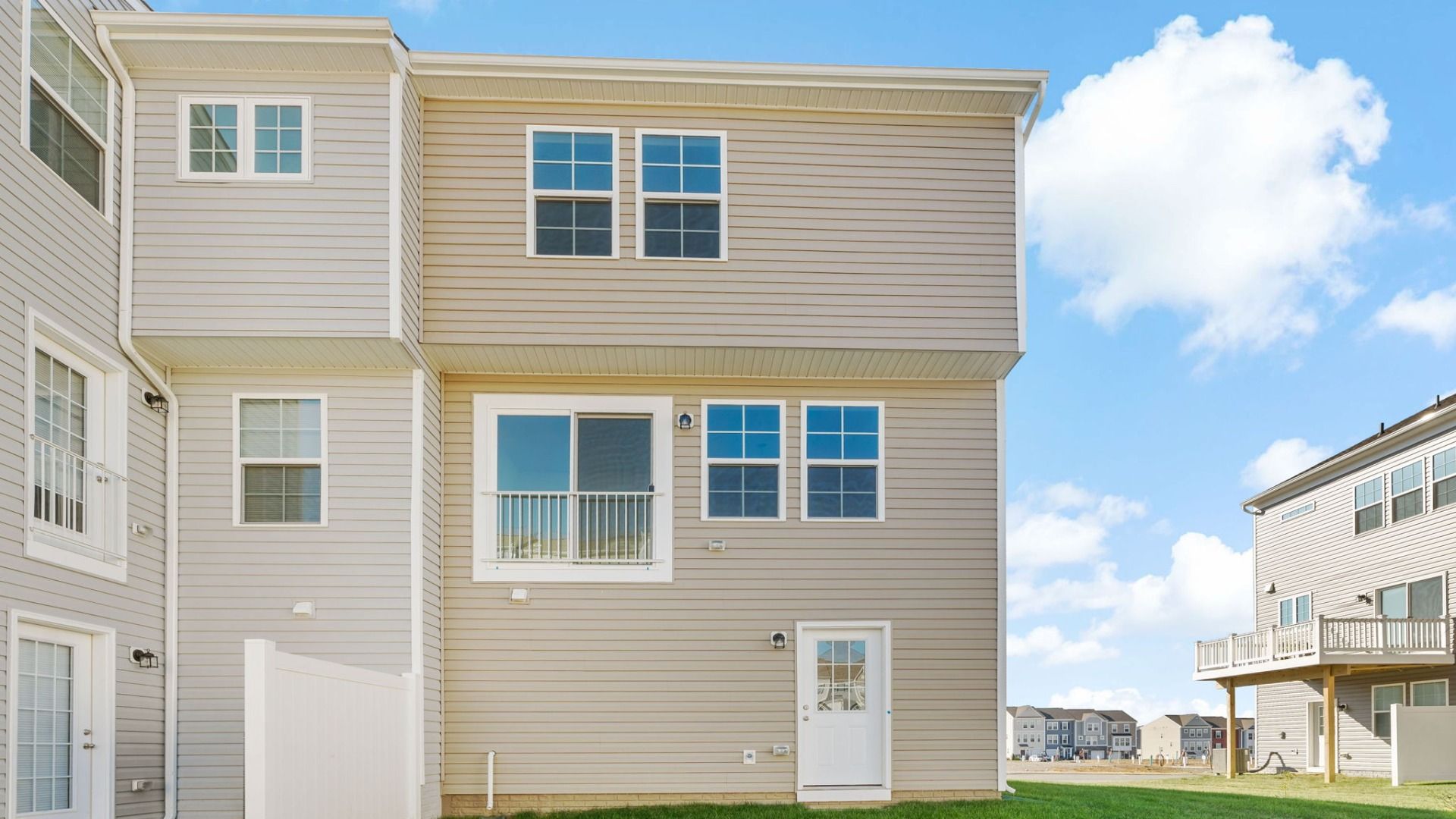 Back exterior view of York II floor plan at Kings Crossing Townhomes by DRB Homes, located in Charles Town, West Virginia.