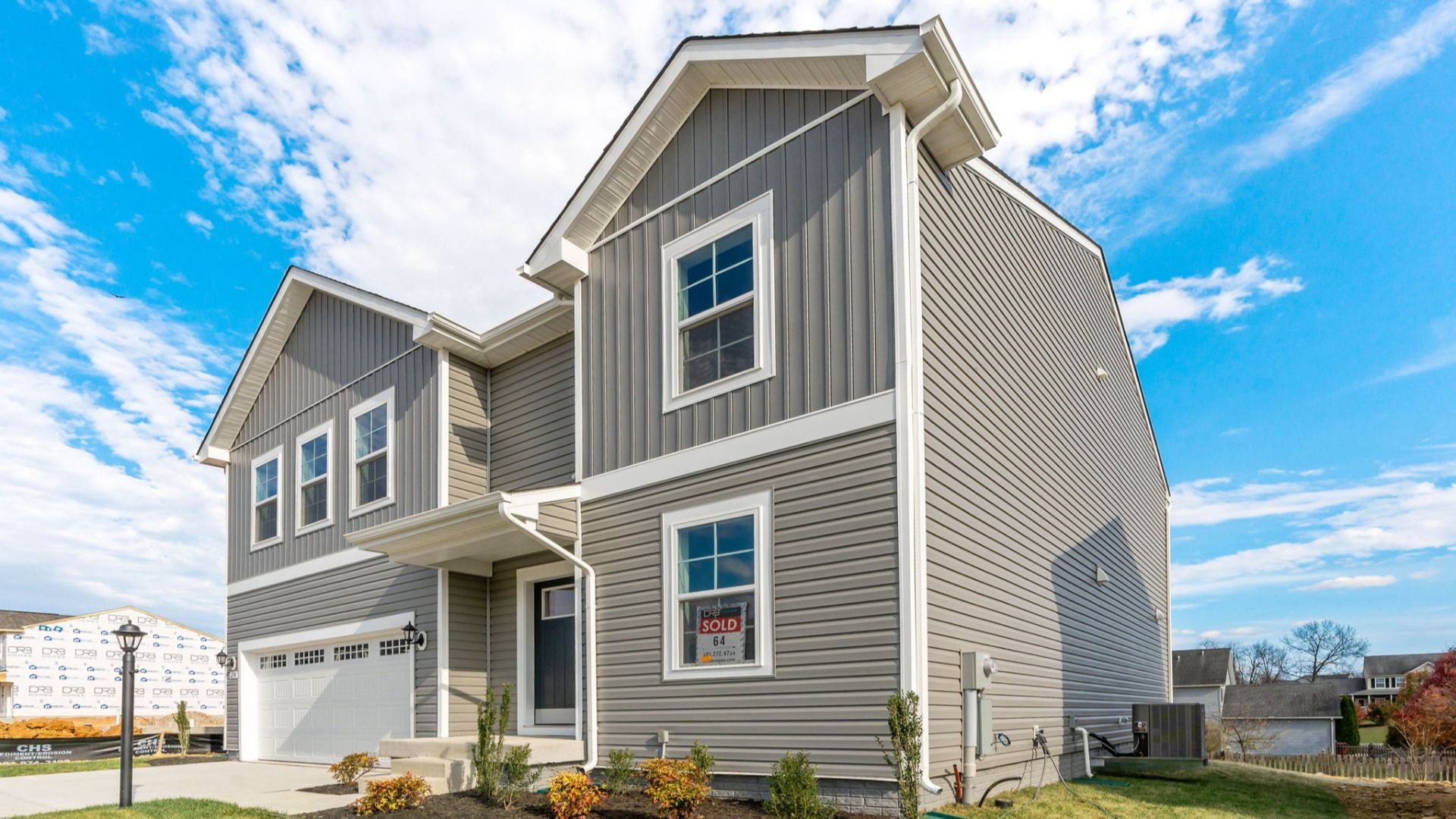 A side exterior view of the Carnegie floor plan showcases its spacious design and outdoor areas.