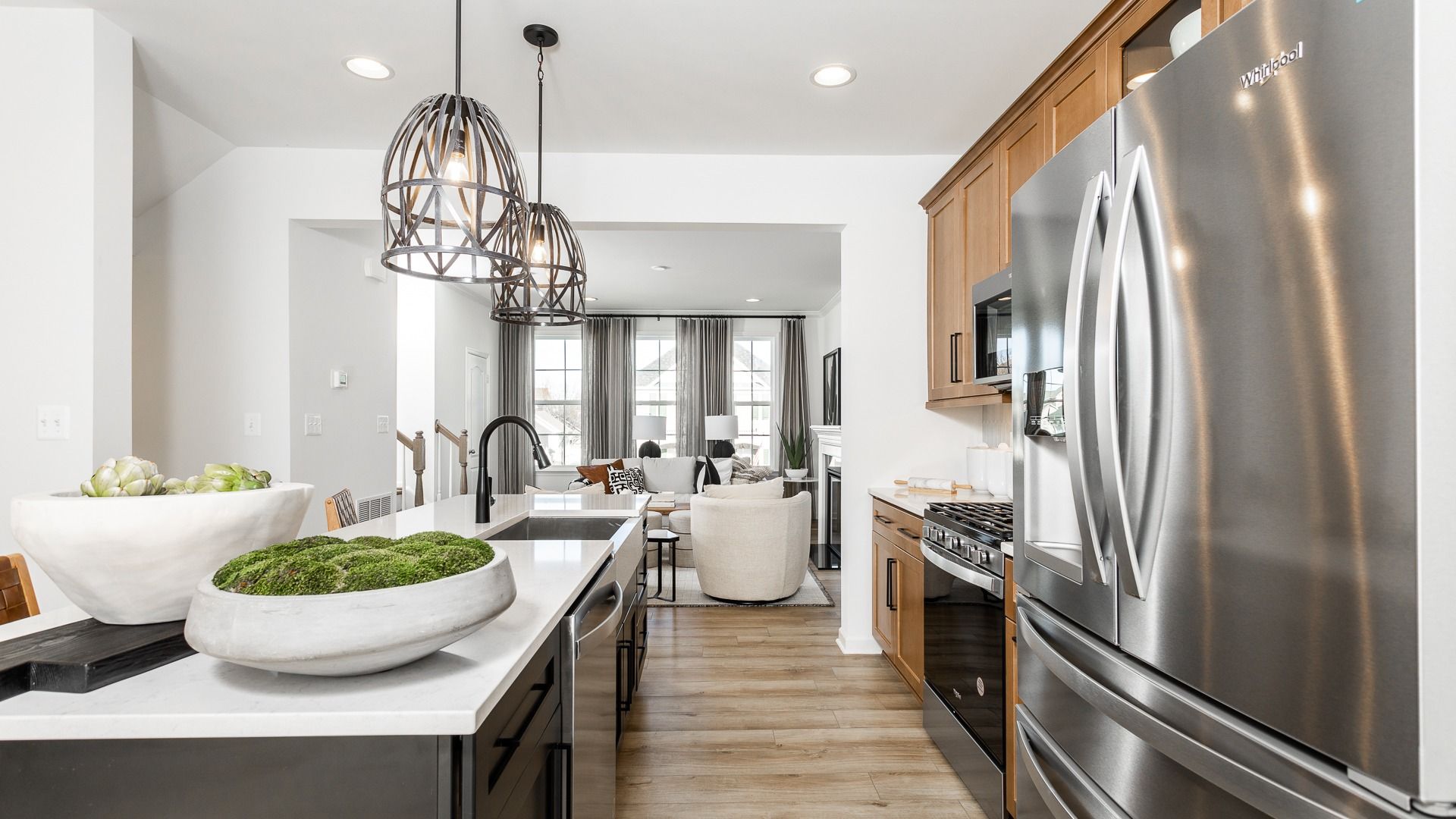 Modern open-concept kitchen with large island in the Bedford II floor plan.