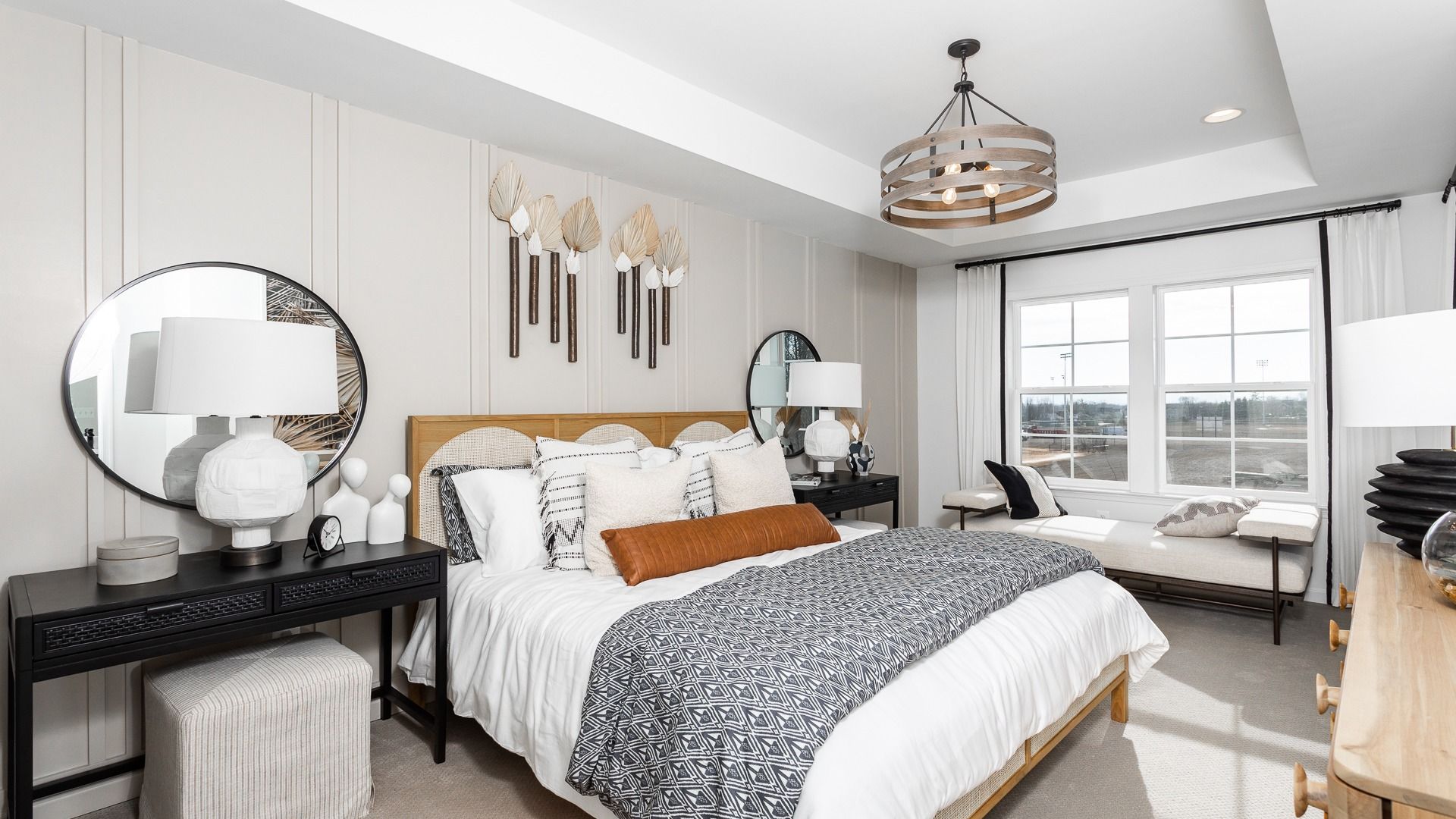 Unwind in the sophisticated owner’s suite of the Bedford II, with a tray ceiling and cozy bed.