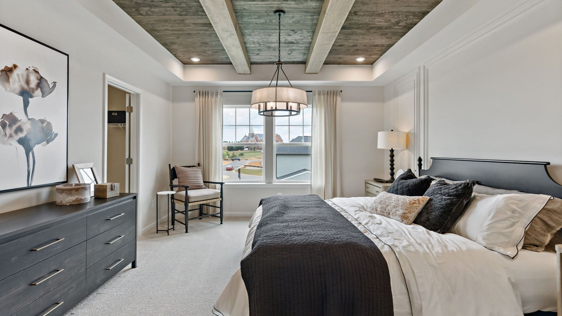 The owner’s bedroom in the York II floor plan offers a spacious, elegant design with a tray ceiling.