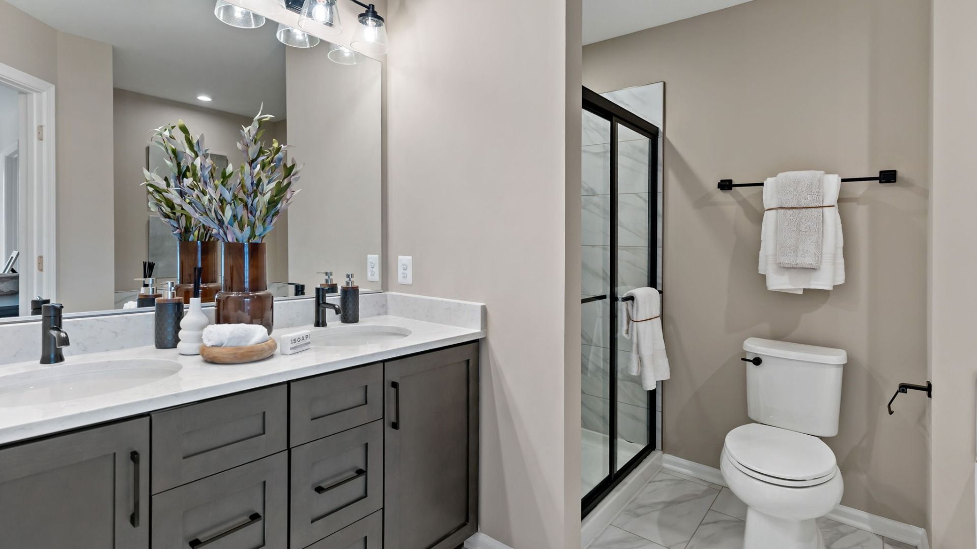 The owner’s bathroom in the York II features a glass shower door, offering a modern, stylish design.