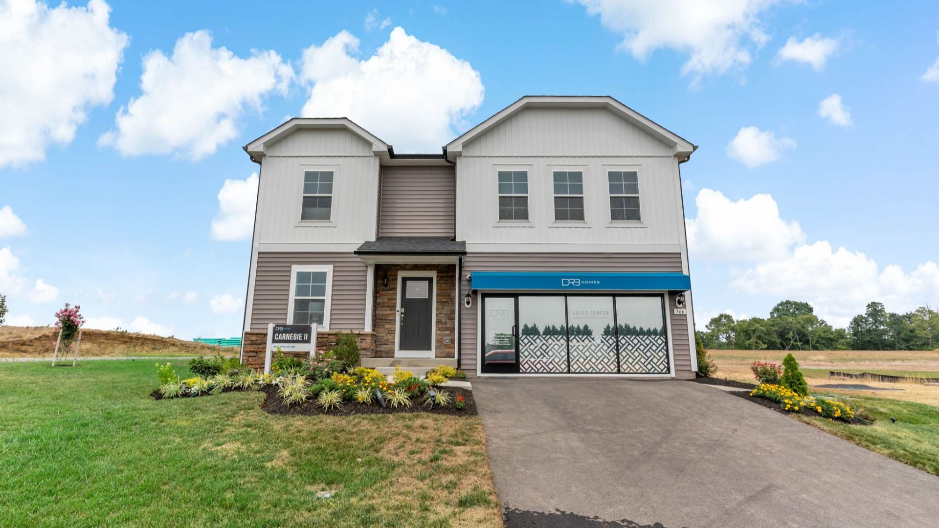 Front exterior view of Carnegie floor plan at South Brook Single Family Homes by DRB Homes, located in Inwood, West Virginia.