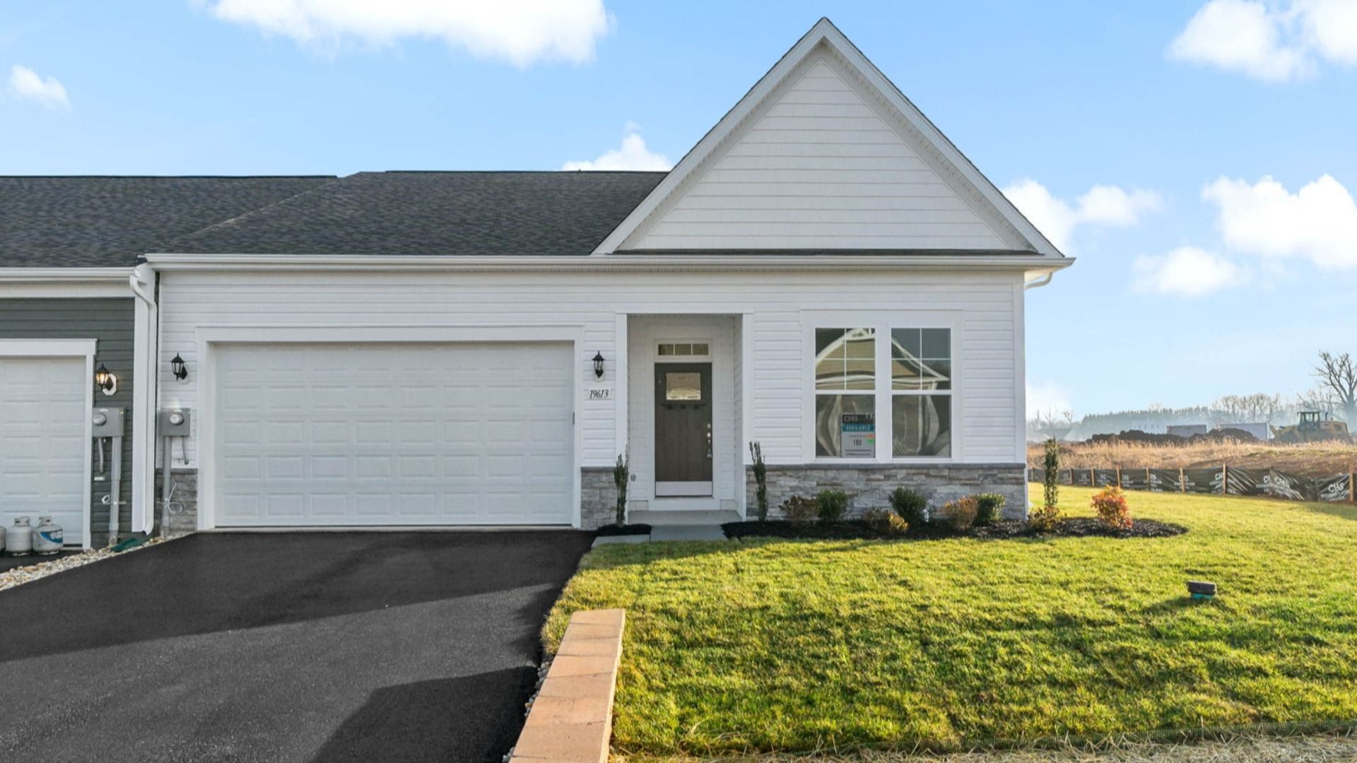 Starling Elevation 5 featuring a stone water table for added character and curb appeal.