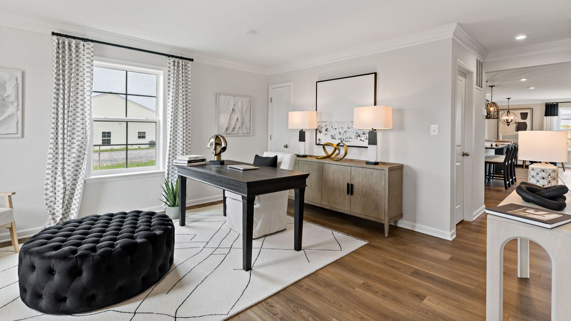 Spacious and bright, the home office in the Carnegie II is perfect for productivity and comfort.