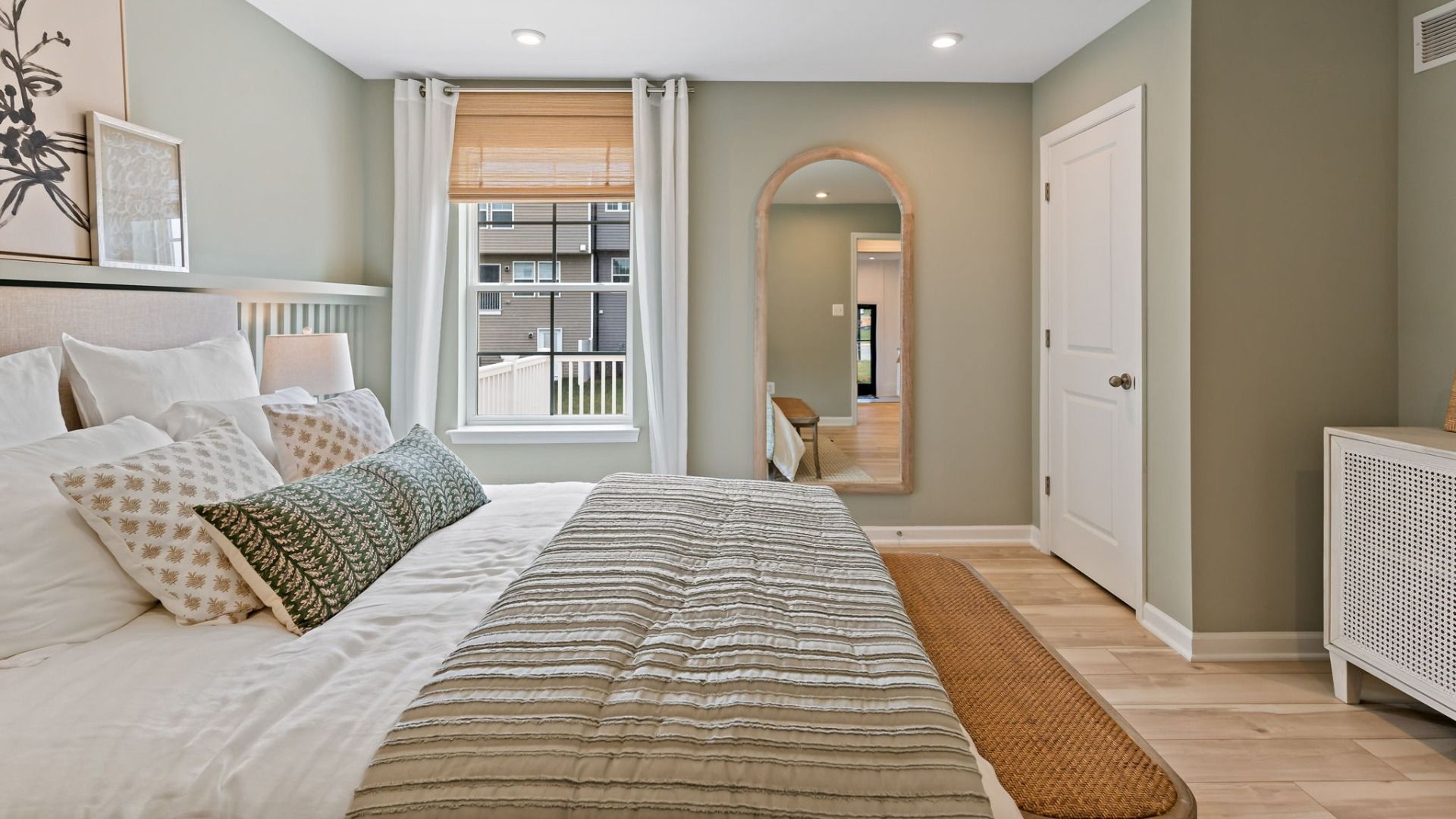The Whitehall II floor plan features a calming primary bedroom with soft hues and cozy textures.