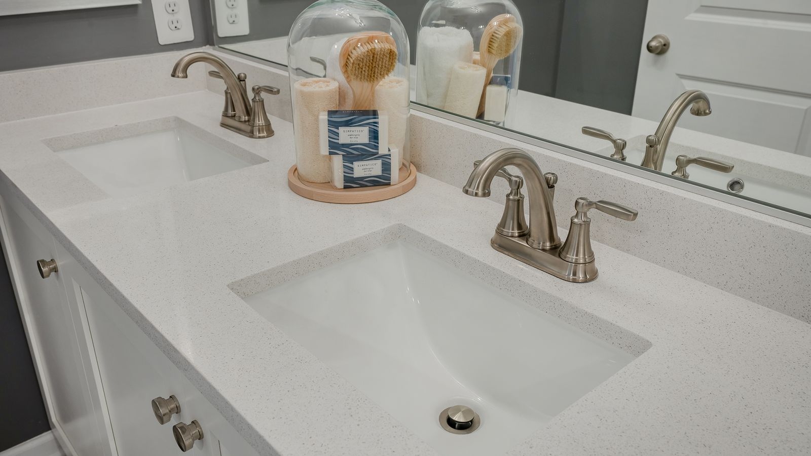 A sleek bathroom in the Carnegie II with a beautifully designed sink and quality finishes.