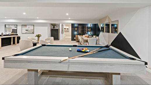 The sleek lower level lounge in the Carnegie II floor plan is the ultimate entertainment space.