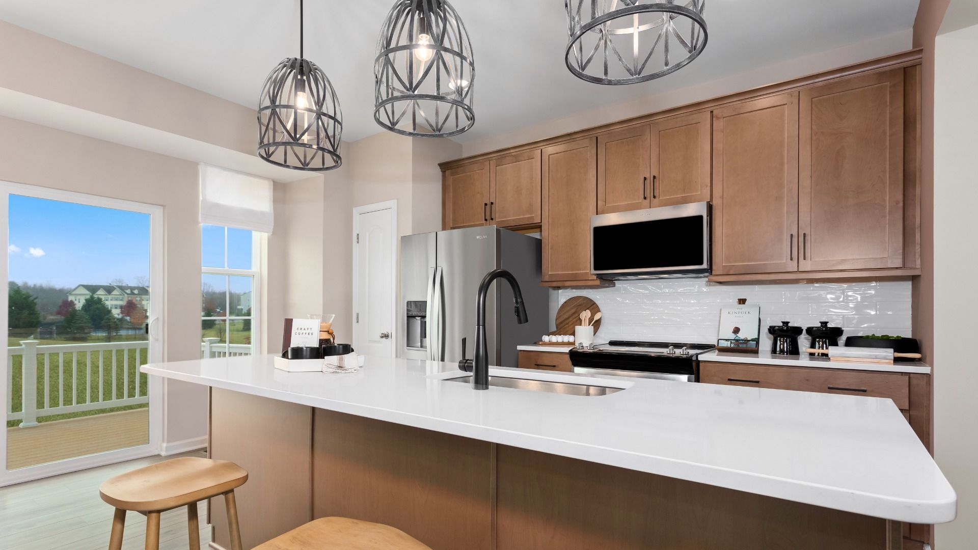 Middle level country kitchen with sand cabinets in the Bedford II home plan.