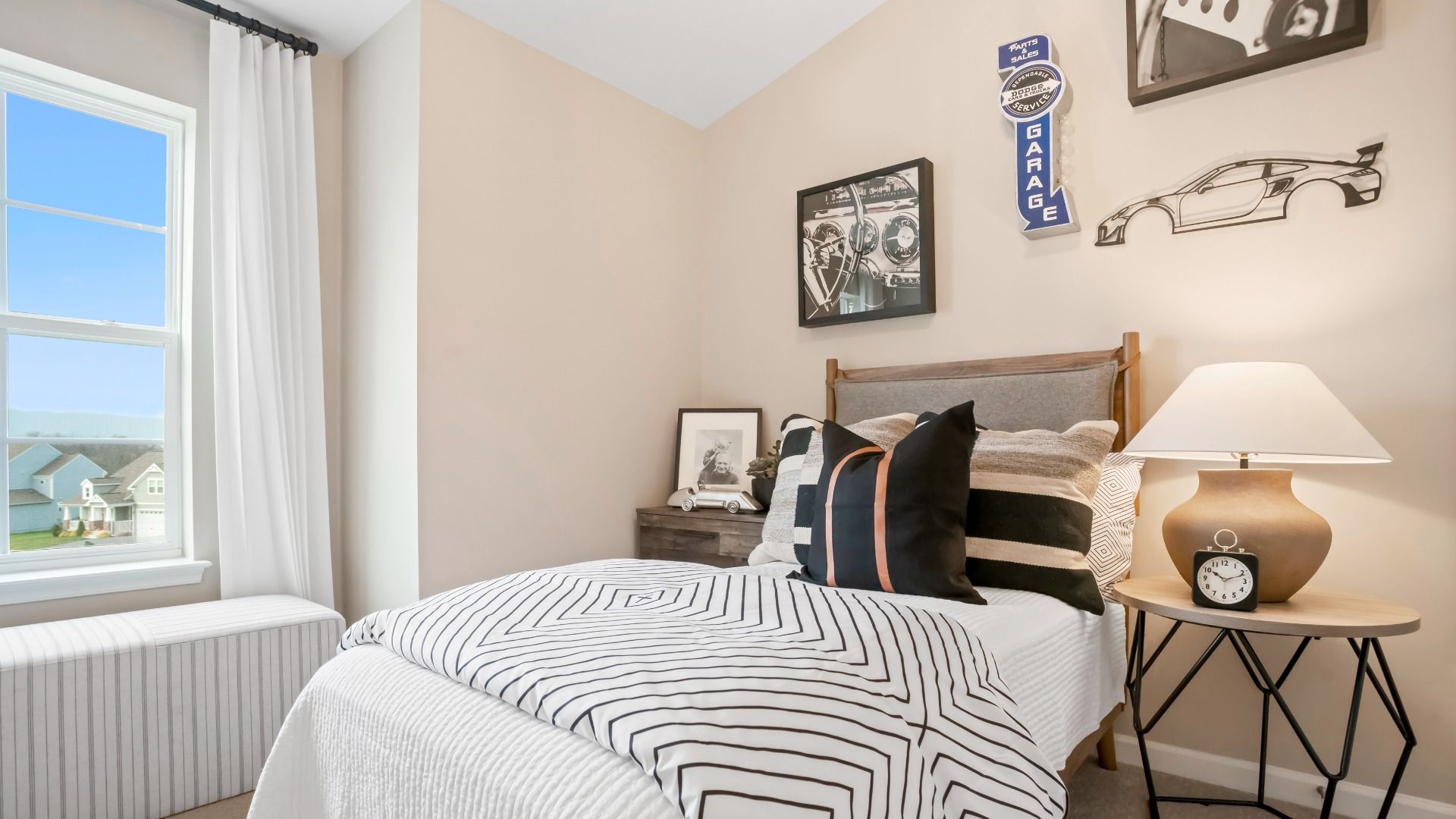 Cozy secondary bedroom with an automotive-inspired theme.