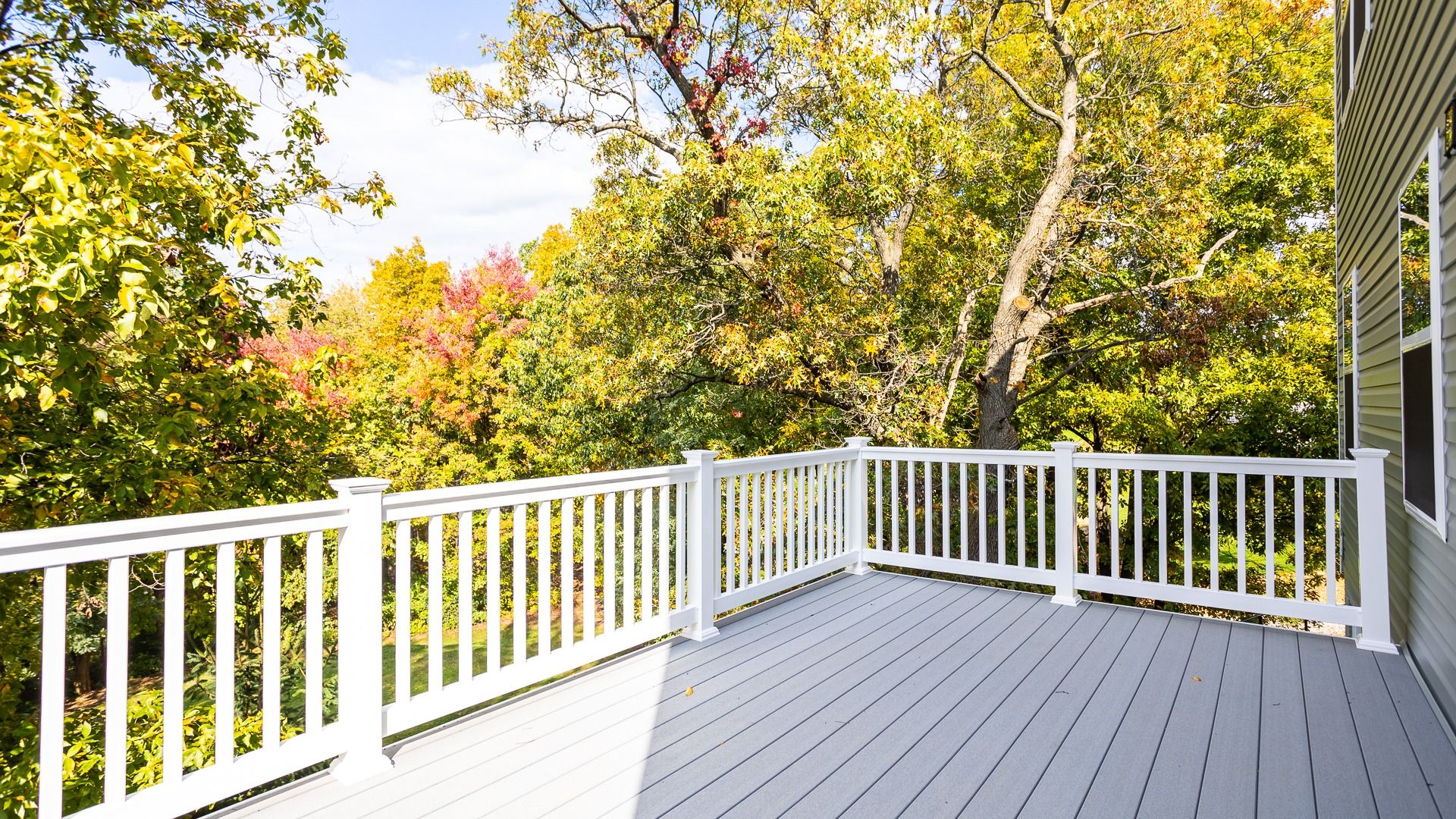 Enjoy peaceful wooded views from this spacious rear deck of the Glenshaw II floor plan.