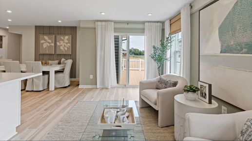 Entertain in the living area of the Whitehall II, featuring natural light and deck access.