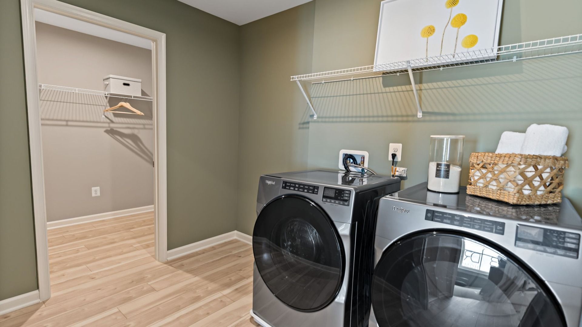 A convenient laundry room in the Whitehall II with modern appliances and ample storage.