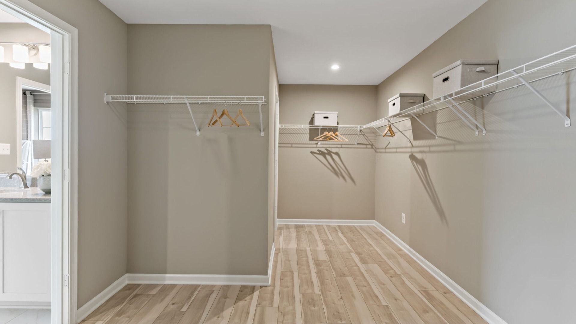 A spacious Whitehall II closet with ample storage and easy access to the owner’s bath.