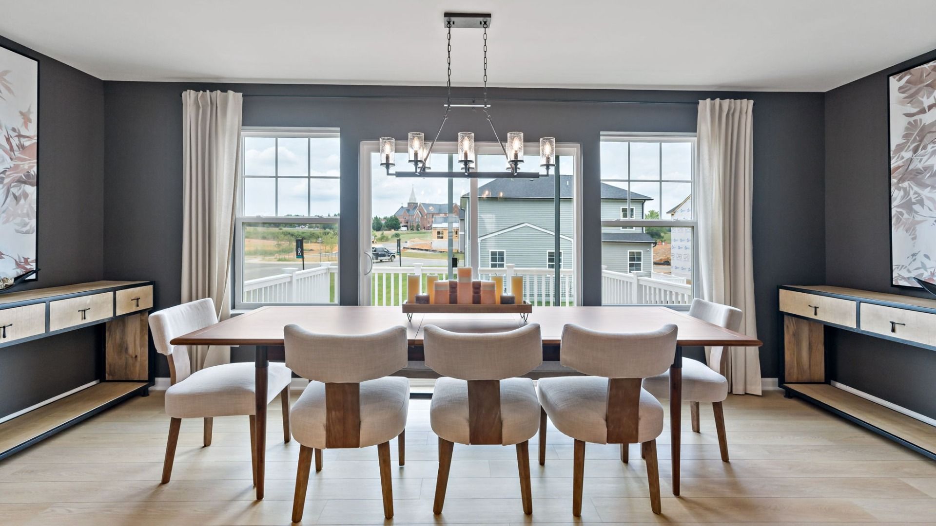 Dining room with a chandelier and plenty of natural light in the York II Garage at The Gallery in Martinsburg, WV.