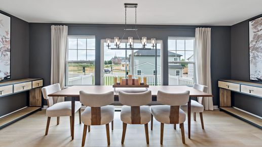 Dining room with a chandelier and plenty of natural light in the York II Garage at The Gallery in Martinsburg, WV.