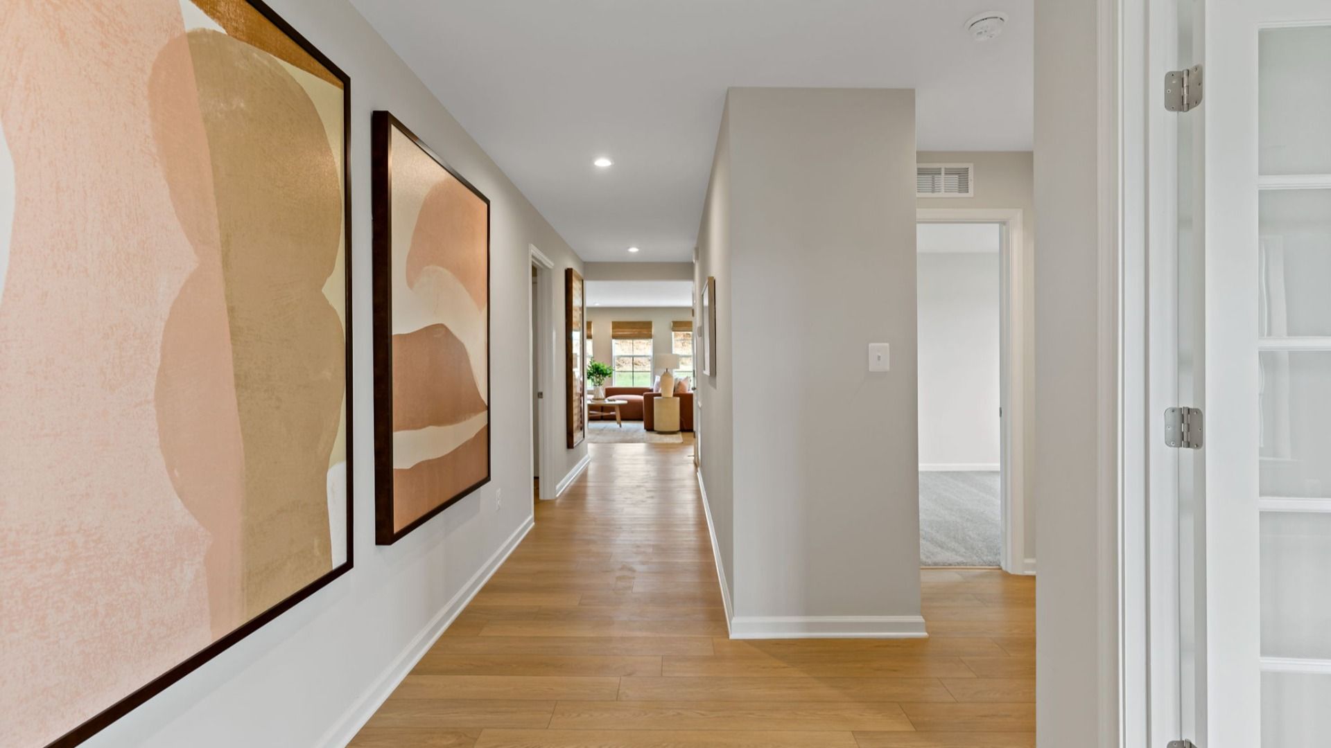 Bright hallway leading to the open living space with natural light in the Edgewood II floor plan.