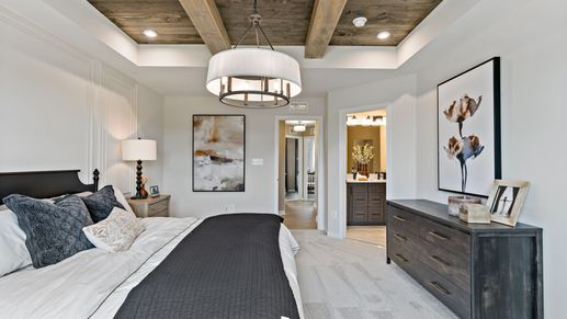 Spacious and stylish bedroom with rustic beams in the York II Garage floor plan at The Gallery, Martinsburg, WV.