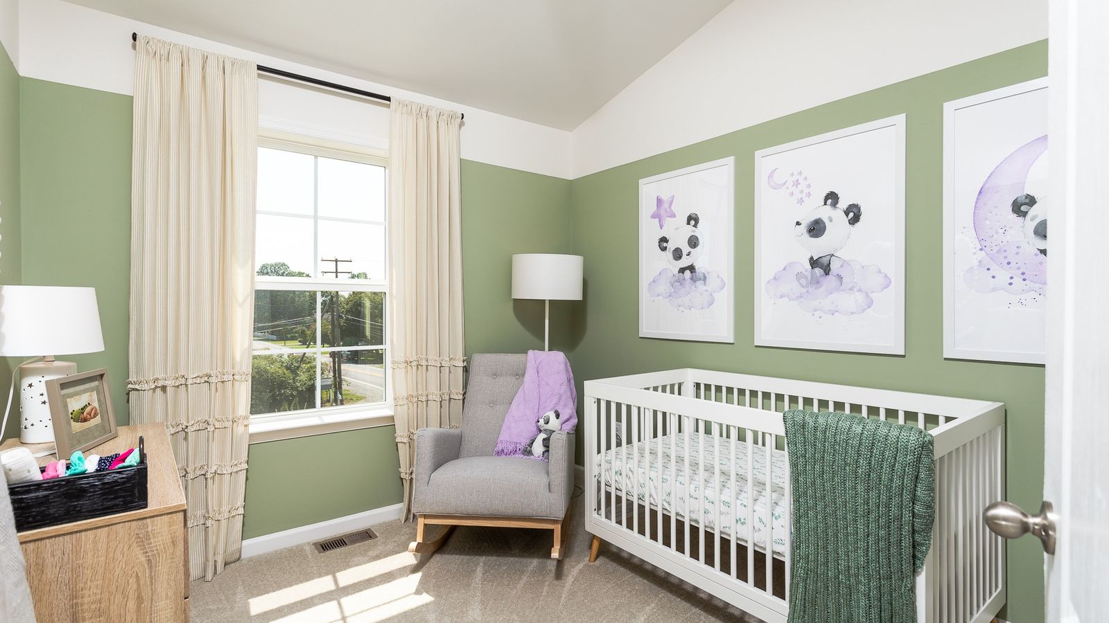 The third bedroom in the York II offers space for the ideal nursery with a crib and rocking chair.