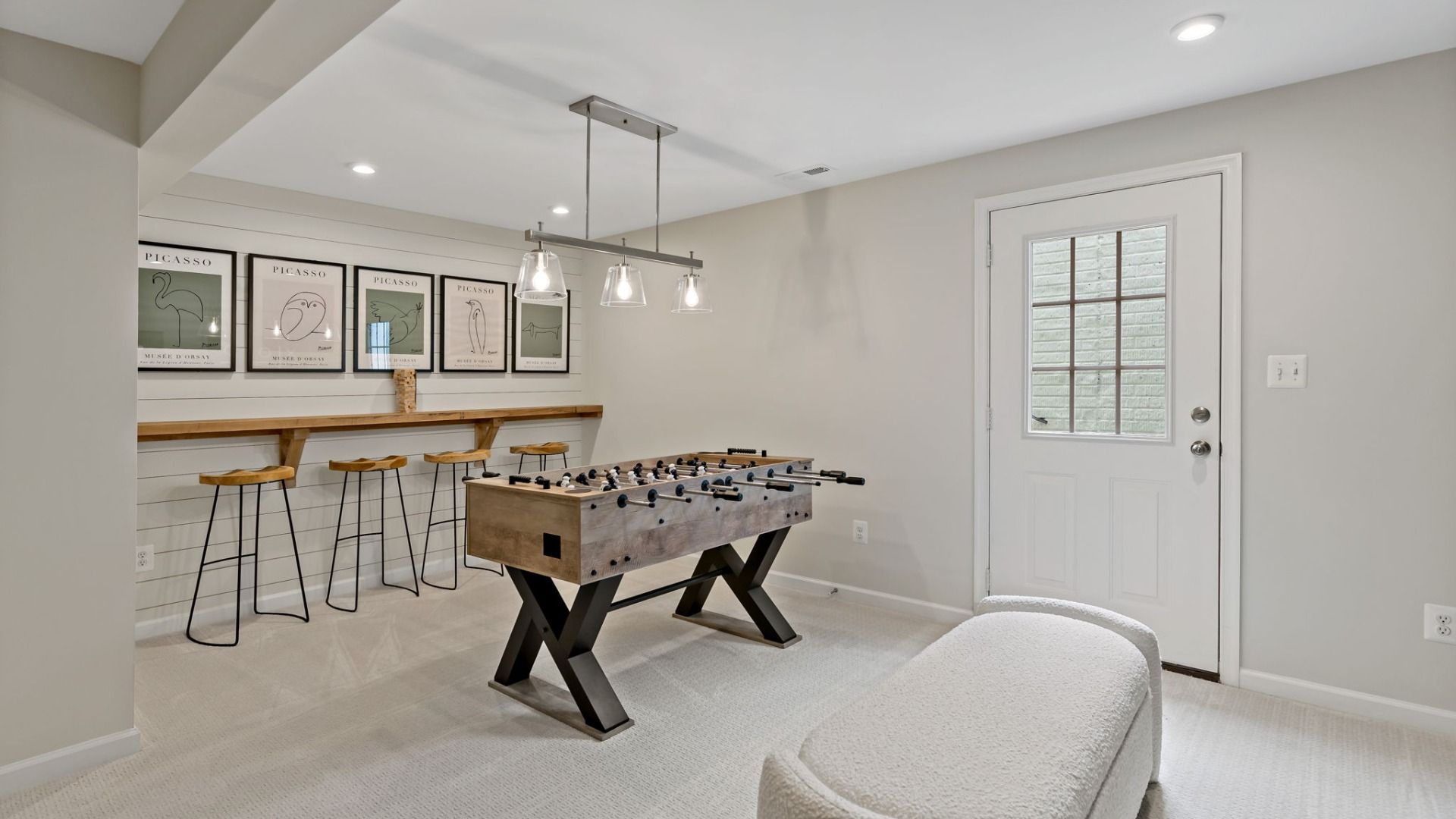 Host friendly competition in the Whitehall II lower level game area, offering fun and relaxation.