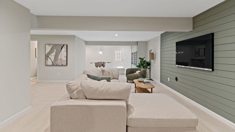 The Whitehall II’s finished lower level offers entertainment and relaxation with a TV and game area.