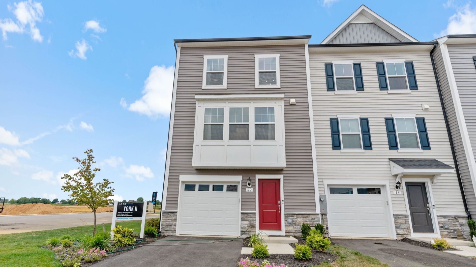 Front view of the York II floor plan with stylish stone accents and garage.