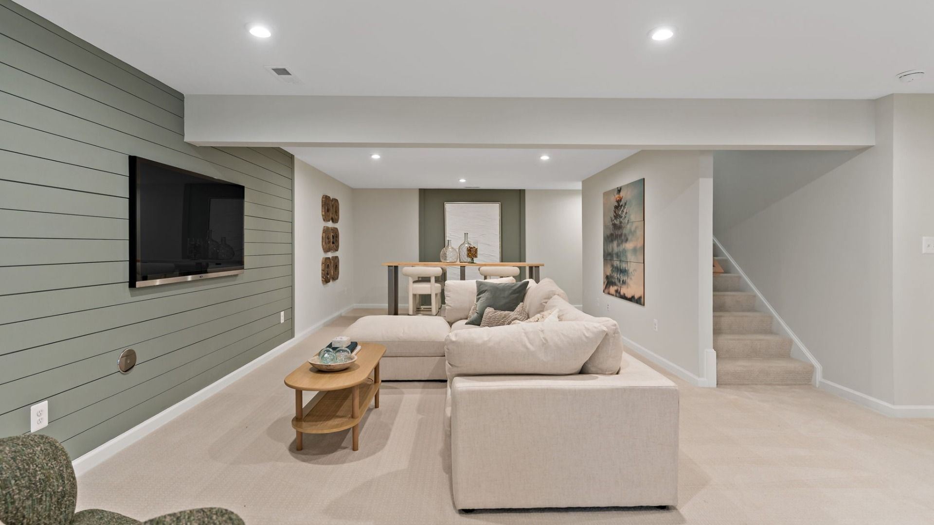 The Whitehall II’s finished lower level blends comfort and style with a lounge, TV, and bar.