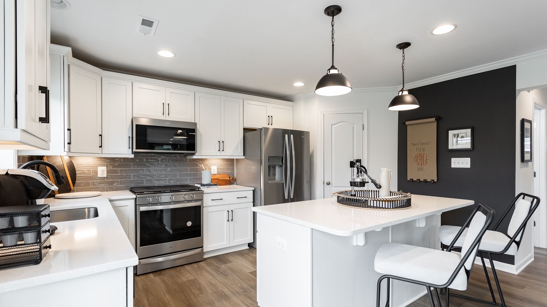 The kitchen in the Carnegie II offers a practical layout with modern appliances.