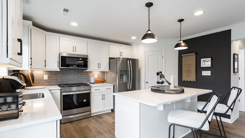 The kitchen in the Carnegie II offers a practical layout with modern appliances.