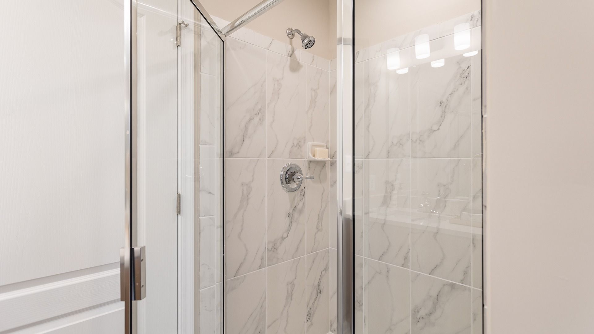 Step into the Carnegie II shower, where light and space create a calming, modern bathroom retreat.