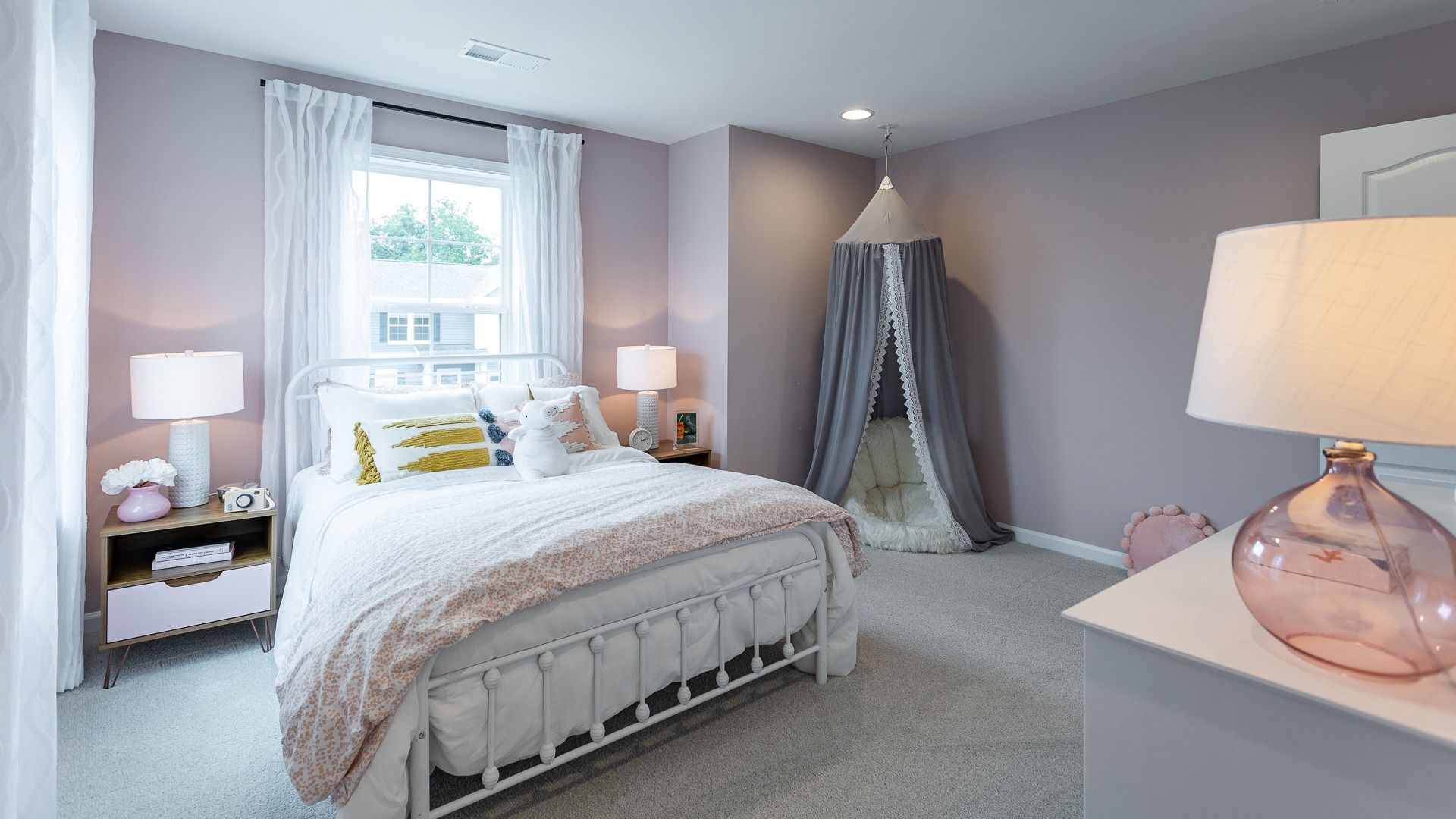 Charming bedroom in the Carnegie II floor plan offers a cozy and inviting space.