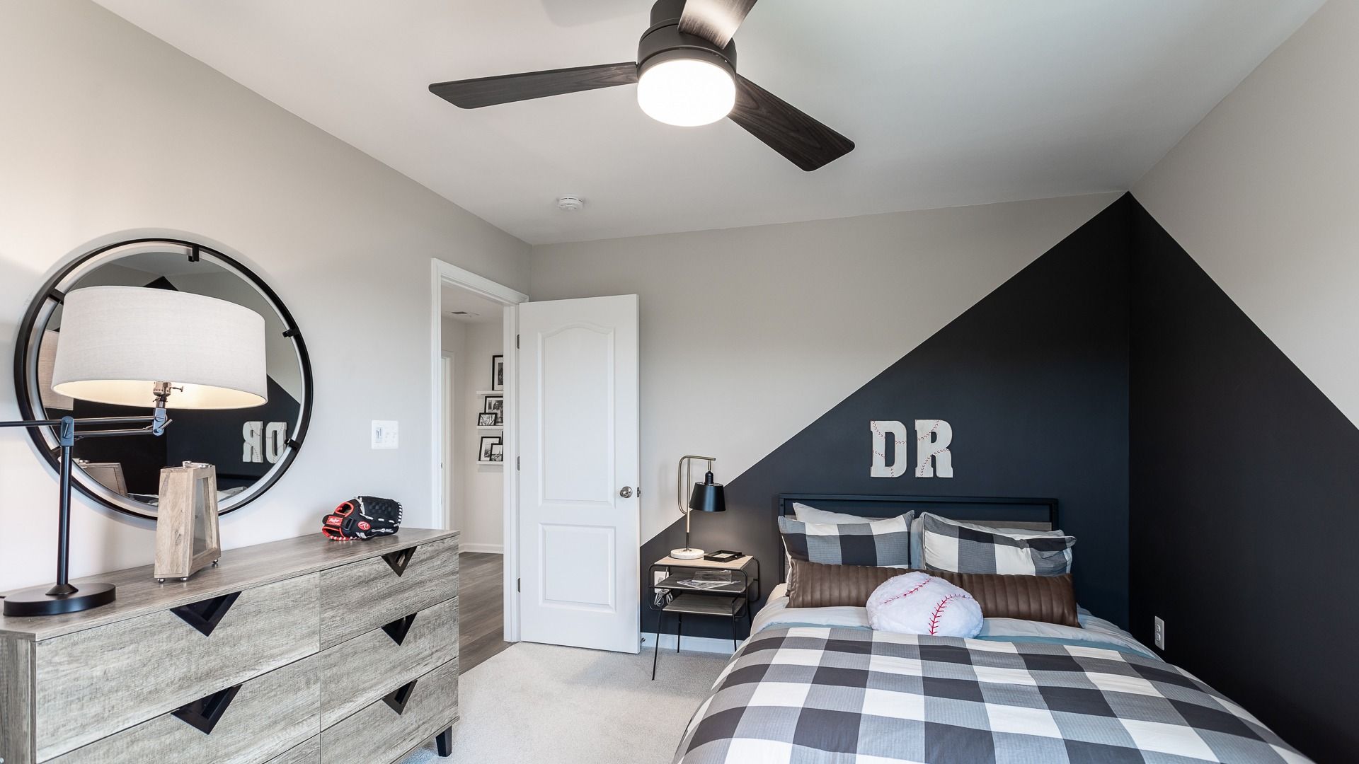 Decorate the third bedroom in the Carnegie boldly with a geometric accent wall for a modern look.
