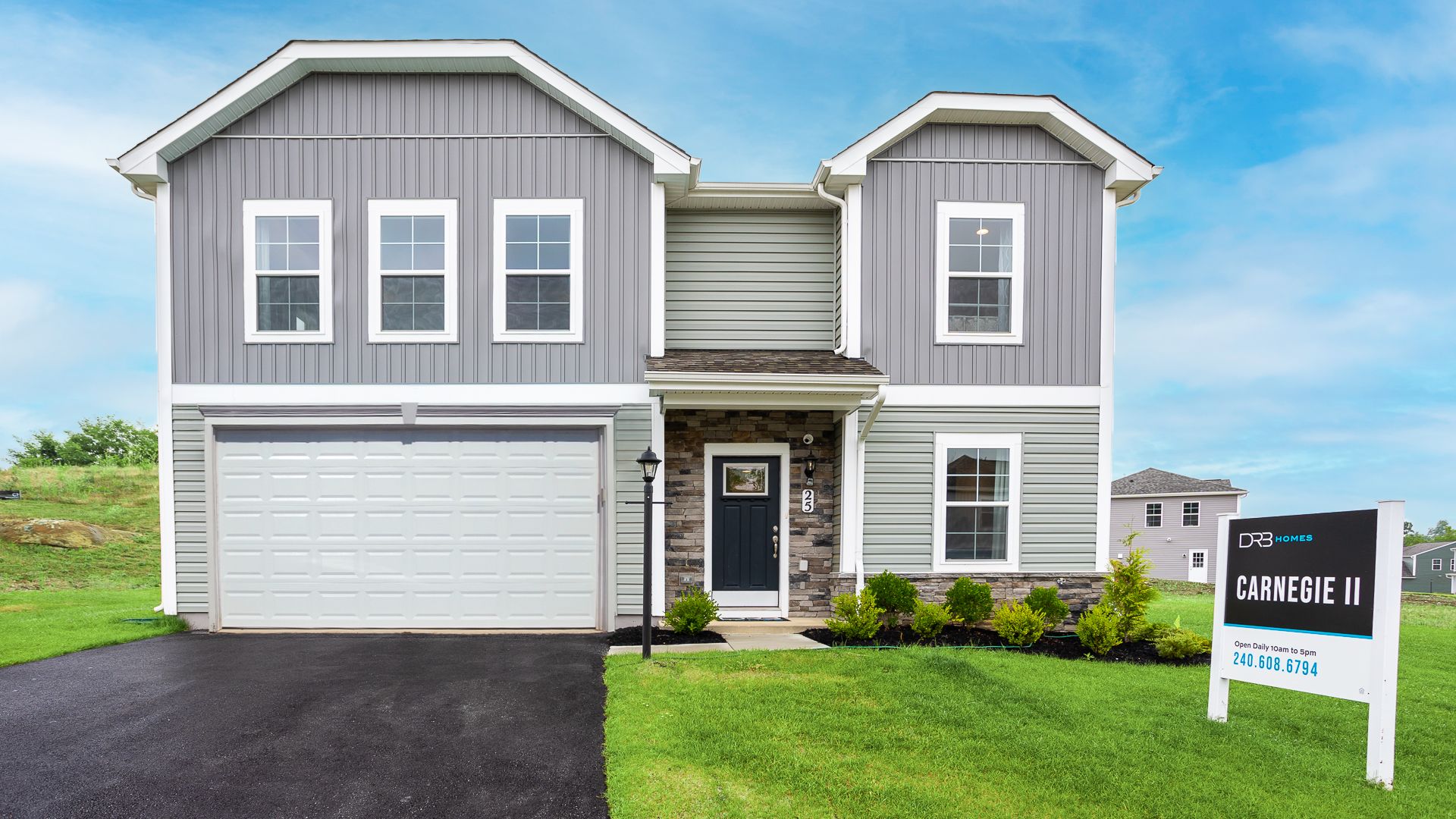 Stone accents and a covered entry give the Carnegie II exterior a classic curb appeal.